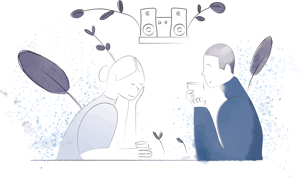 Man and woman setting across from each other, drinking from cups with music player in the background.